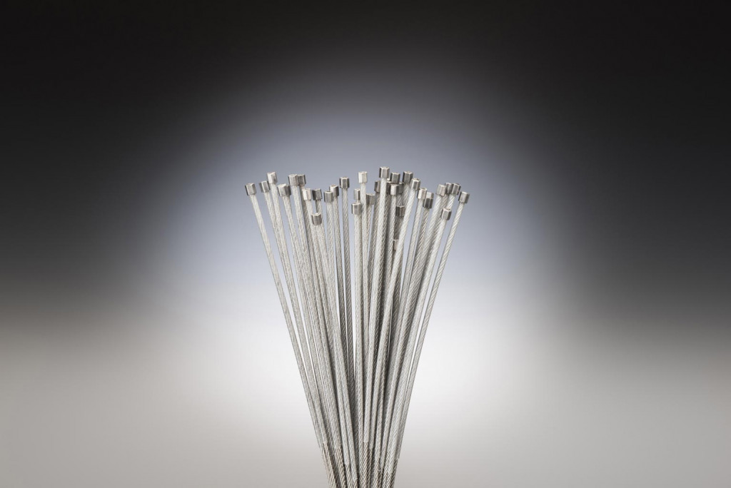 Plastic coated cable assembly with ferrule