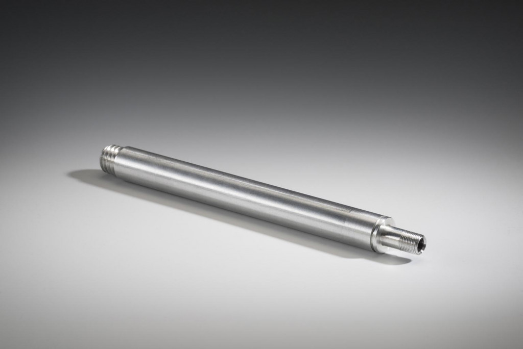 Double sided threaded precision machined part